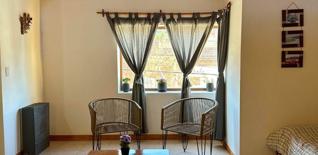 Living con vista a las montañas en departamento en Esquel